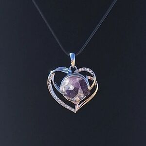 Magnificent Amethyst and Angel Aura heart with 24 inch cord